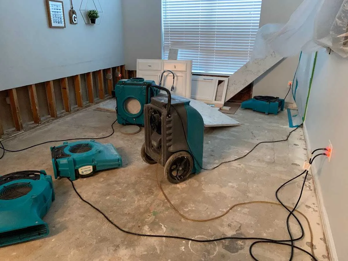 Dehumidifier in flood-cut room for Water Damage Restoration in Vienna